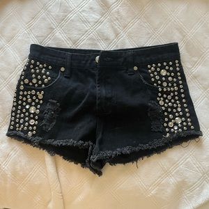 Black studded ripped jean shorts